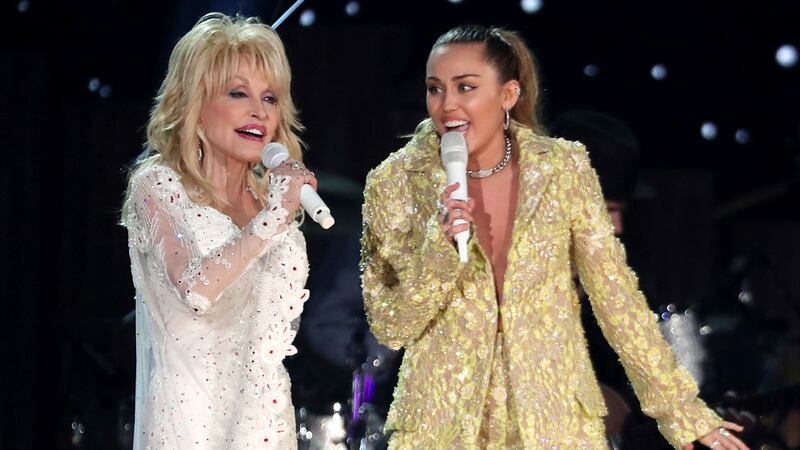 FILE - Dolly Parton, left, and Miley Cyrus perform "Jolene" at the 61st annual Grammy Awards...