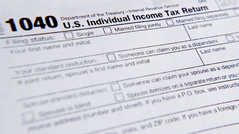 FILE - A 1040 tax form printed from the Internal Revenue Service web page is seen, Feb. 13,...