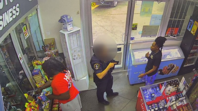 Video of officer approaching woman with gun drawn at Birmingham gas station sparks questions,...