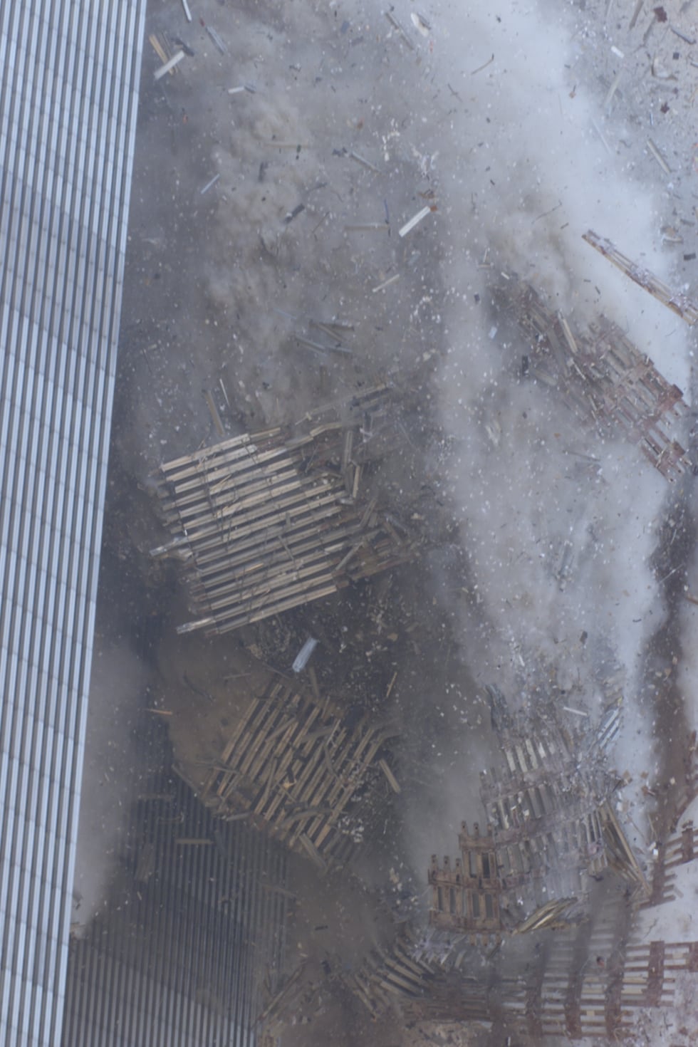 The south tower of the World Trade Center twin towers begins to collapse after hijacked planes...