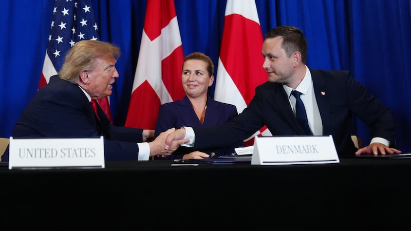 President Donald Trump shakes hands with Greenland's Prime Minister Jens-Frederik Nielsen,...