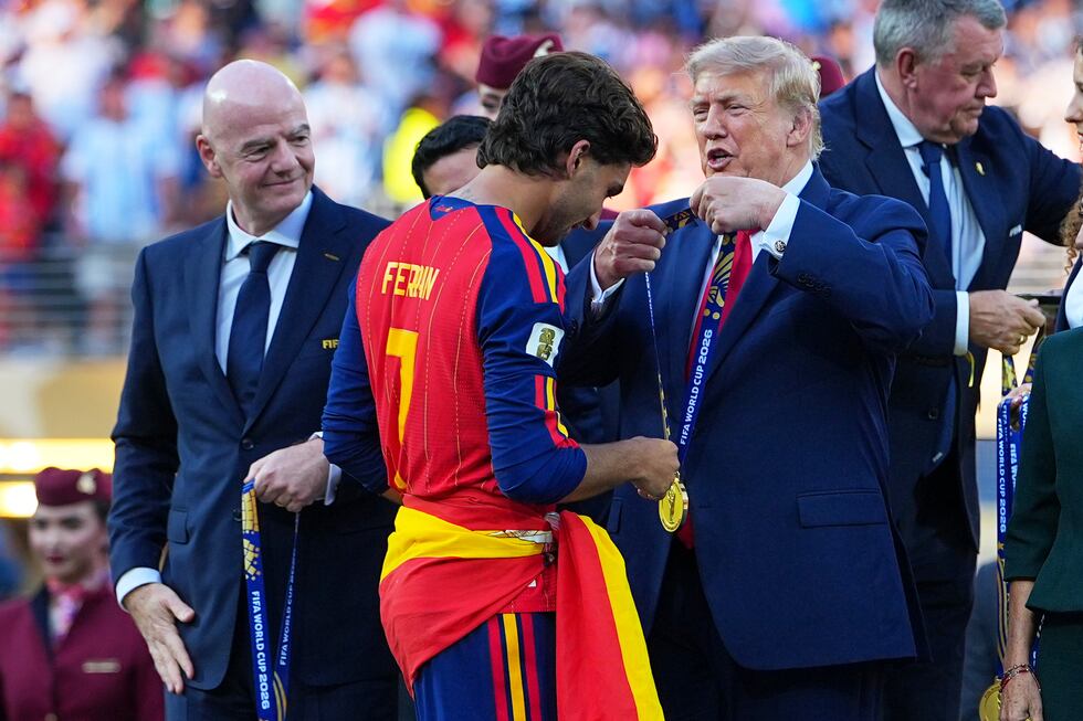 President Donald J. Trump gives Spain's Ferran Torres (7) winners metal during the World Cup...