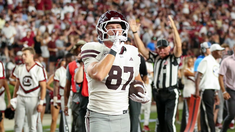 Mississippi State tight end Sam West (87) hushes the opposing fans after a 7-yard touchdown...