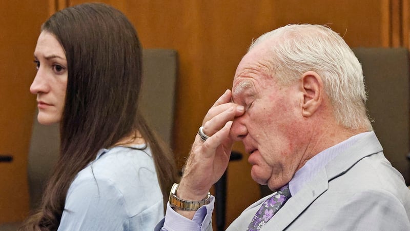 Lindsay Clancy and attorney Kevin Reddington watch as Judge William Sullivan tells the jury to...
