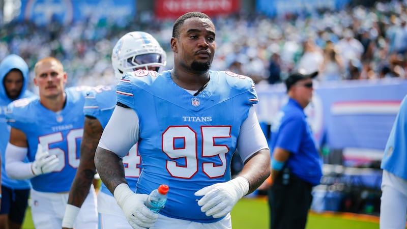 Tennessee Titans defensive lineman Jordan Elliott (95) walks to the locker room at halftime of...
