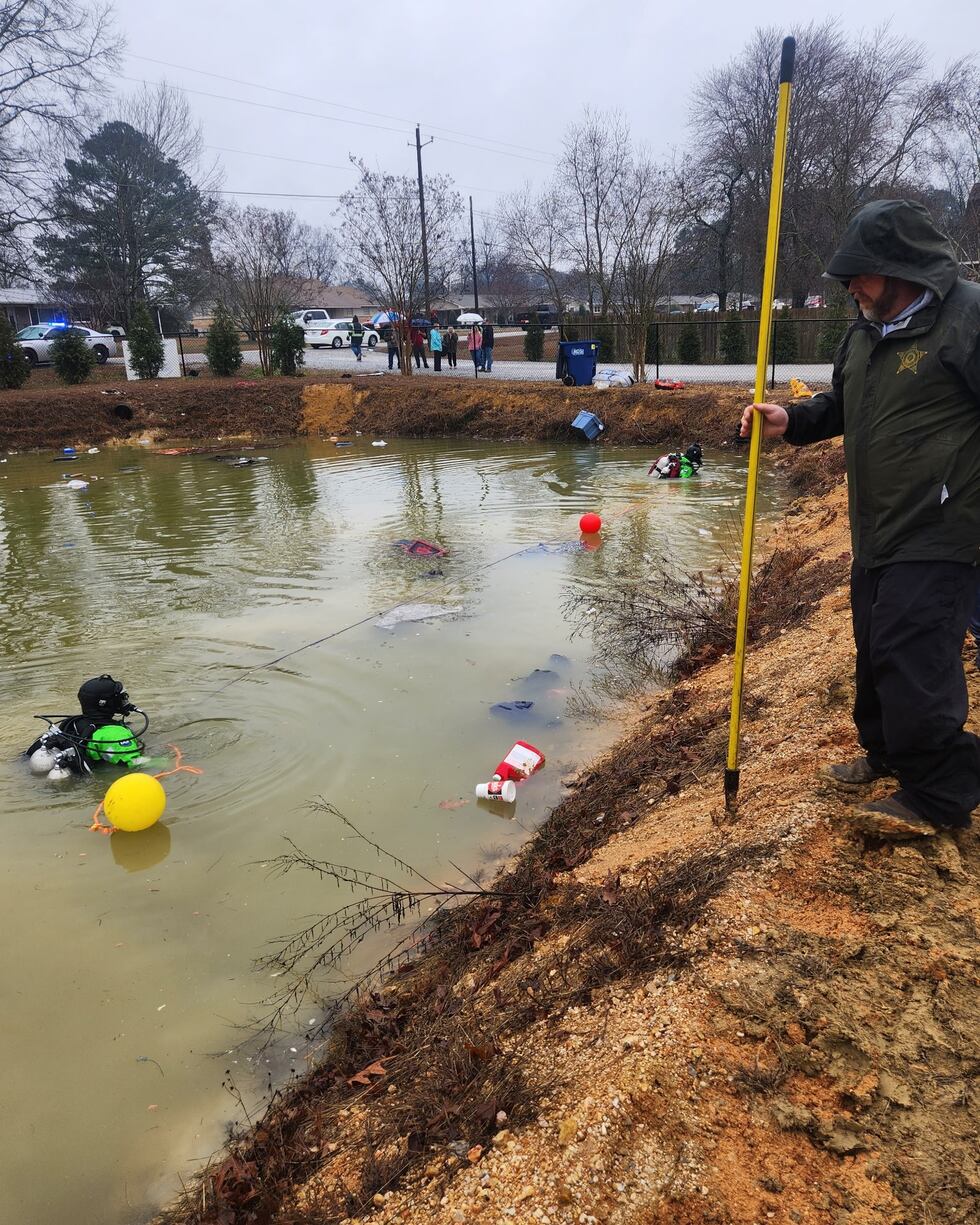 The Etowah County Dive Team recovered a woman's body from a pond Sunday after a crash.