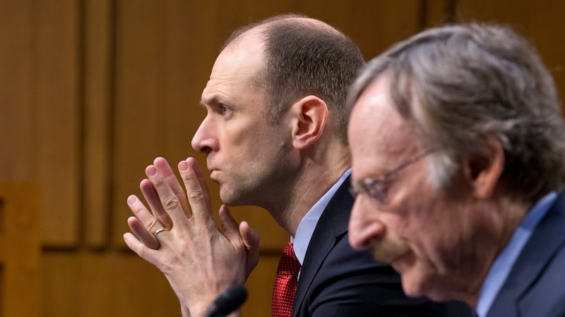 FILE - Austan Goolsbee, left, then-Council of Economic Advisers Chairman under President...
