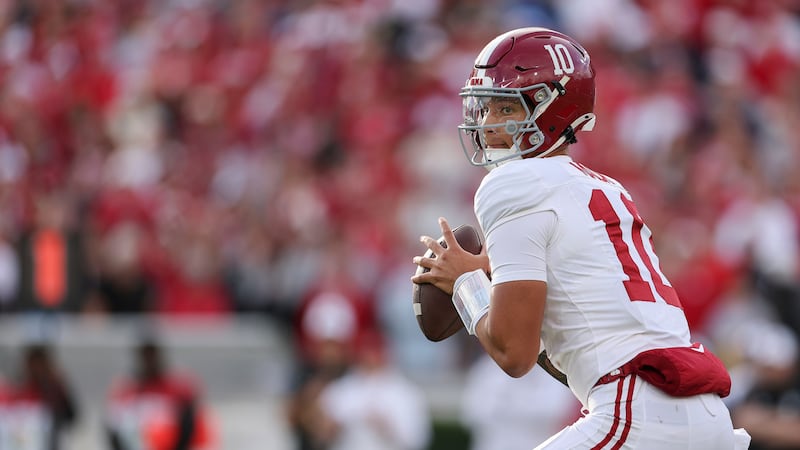 Alabama Crimson Tide quarterback Austin Mack (10) drops back to pass during the game between...