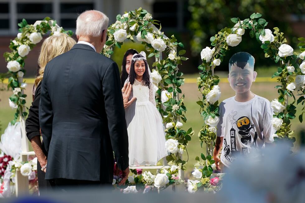 President Joe Biden and first lady Jill Biden visit a memorial at Robb Elementary School as...