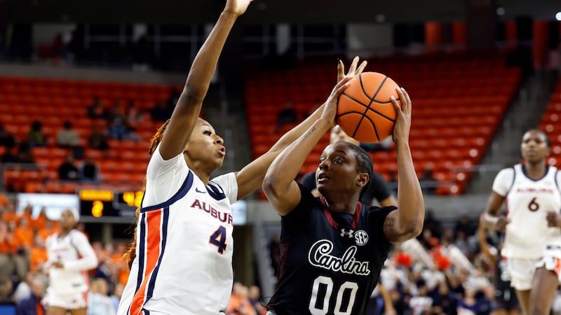 South Carolina guard Ta'niya Latson (00) looks to shoot as Auburn guard Kaitlyn Duhon (4)...