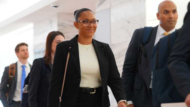McKenna West, left, arrives with her legal team for a court hearing in Dallas, Tuesday, Aug....