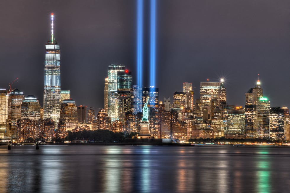 9/11 Memorial Beacons Shining with Statue of Liberty and New York City Skyline