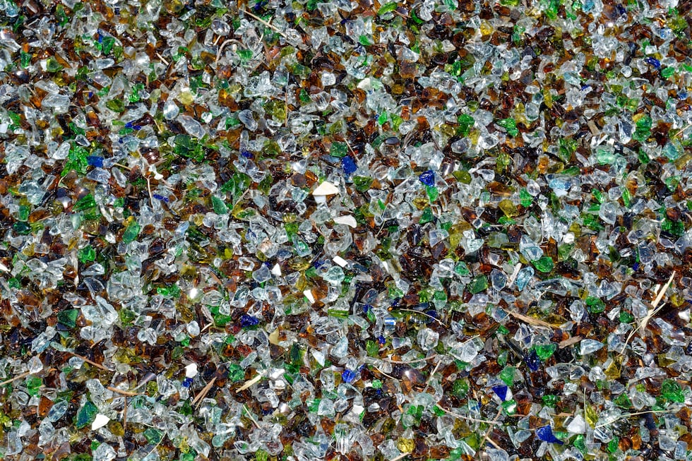 A mosaic of multicolor tiny crushed glass used for mulch or other decorative purpose great use...