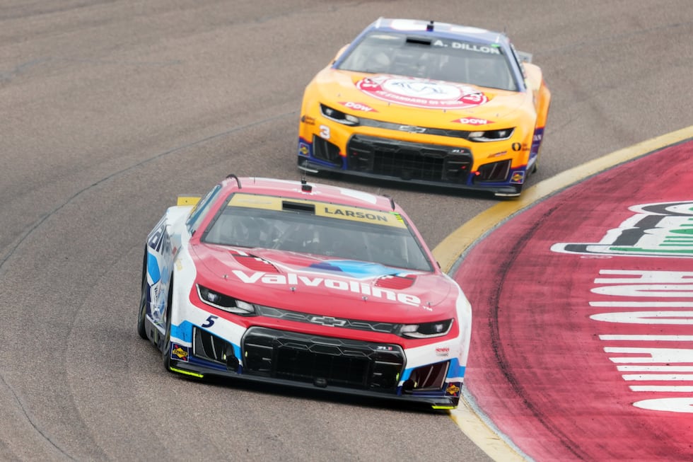 Kyle Larson (5) leads Austin Dillon on the 12th lap during a NASCAR Cup Series auto race...
