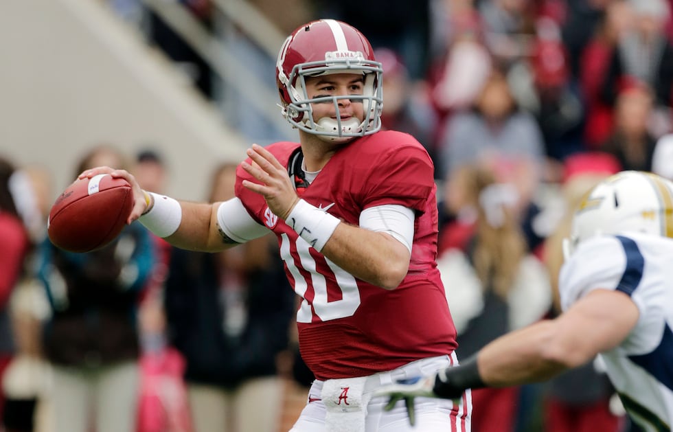 Alabama quarterback AJ McCarron (10) looks for a receiver during the first half of an NCAA...