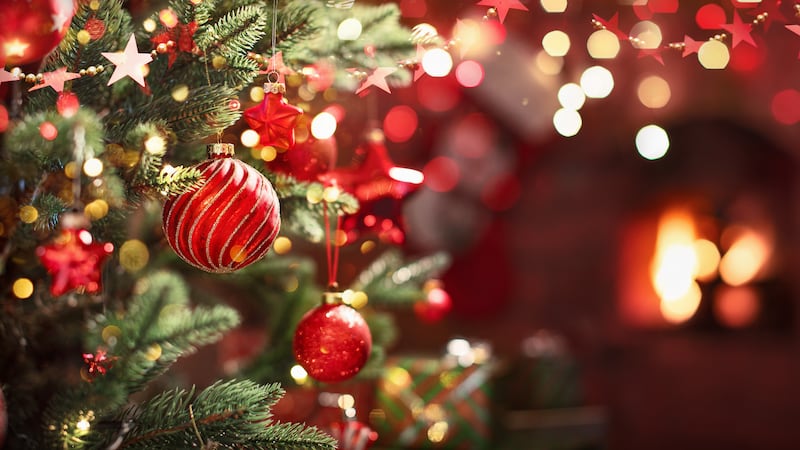 Christmas Tree with Red Balls and Stars. Winter Holiday Background