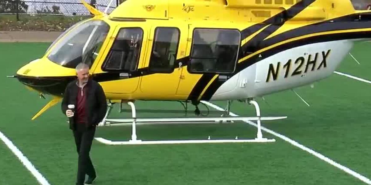 Bell 407 helicopter N12HX at Ramsay High School during Mike Norvell's recruiting visit