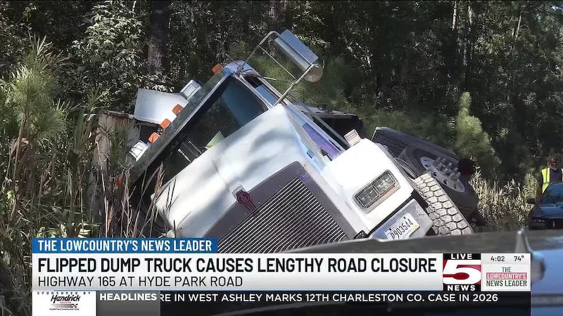 A dump truck has overturned, forcing a road closure in Charleston County.